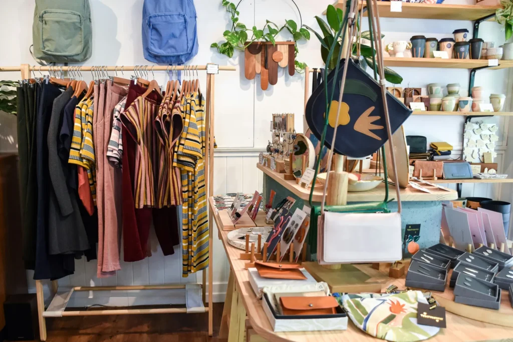 MSME products such as clothes, bags, tumblers, and many more are displayed and sold in a shop.