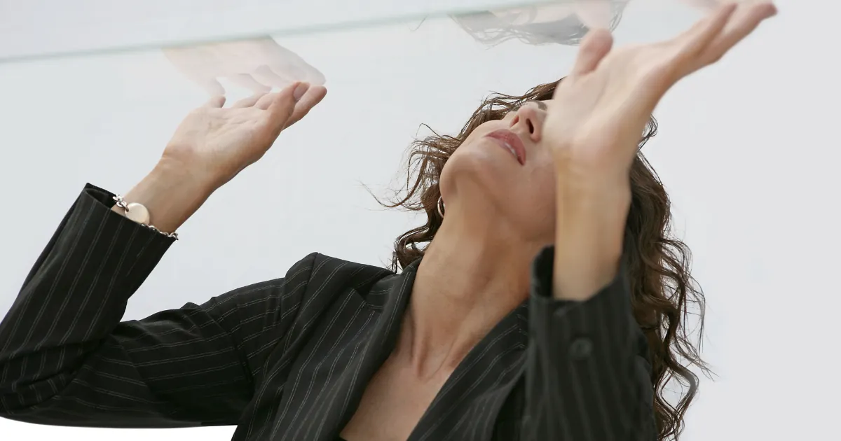 Illustration of the glass ceiling as an invisible barrier to career growth and advancement