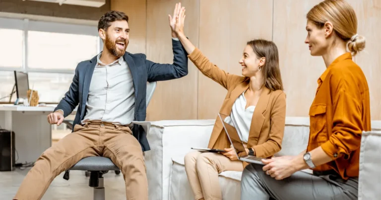 Illustration of happy employees staying with a company because of a positive work environment, career growth, and supportive leadership
