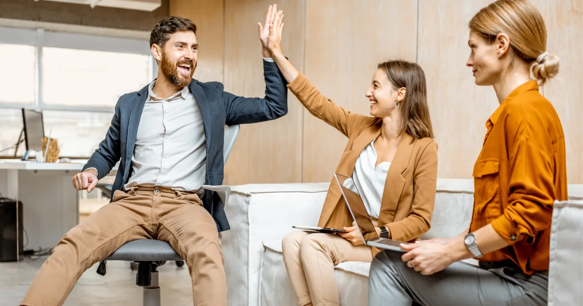 Illustration of happy employees staying with a company because of a positive work environment, career growth, and supportive leadership